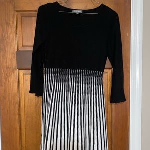 Little black and white dress almost knee length. Only worn once or twice.